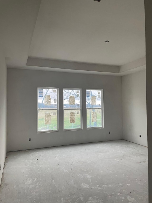 empty room with a tray ceiling