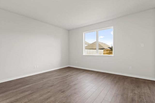 empty room featuring dark hardwood / wood-style floors