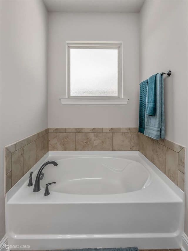 bathroom featuring a washtub