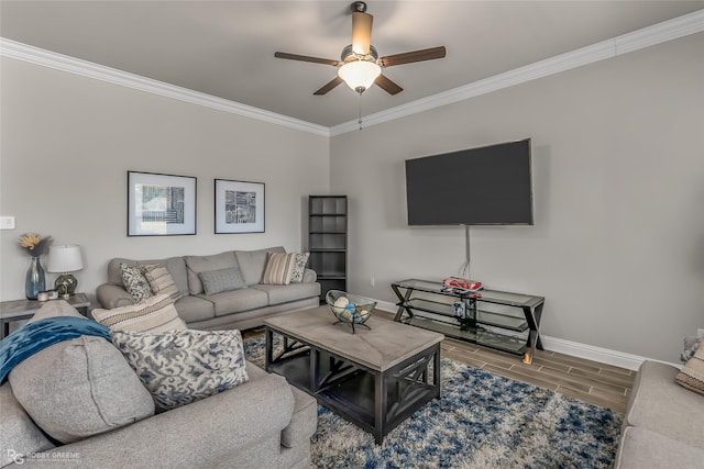 living room featuring crown molding and ceiling fan