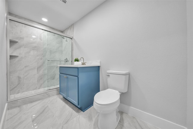 bathroom featuring vanity, toilet, and a shower with door