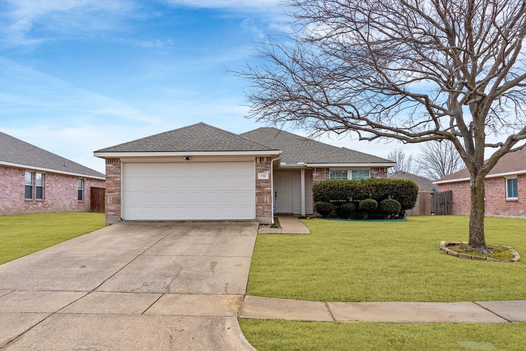 single story home with a garage and a front yard