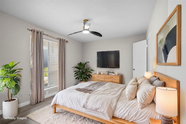 bedroom featuring hardwood / wood-style floors and ceiling fan