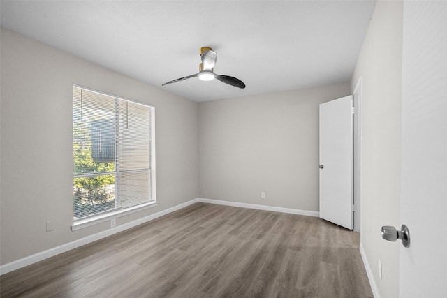 unfurnished room with ceiling fan and light wood-type flooring