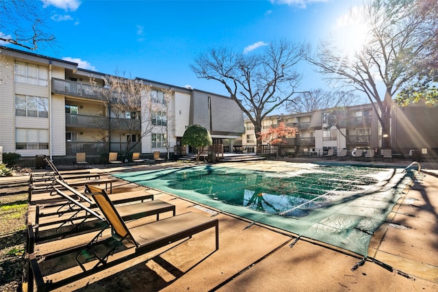 view of swimming pool with a patio area