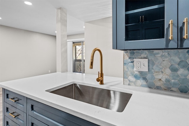 kitchen with tasteful backsplash and sink