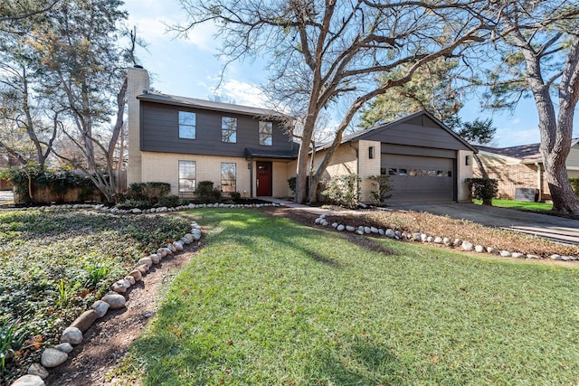 view of front of property featuring a garage and a front lawn