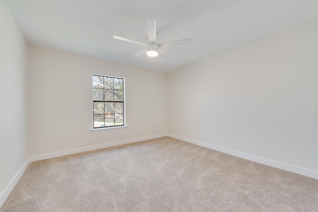 empty room with carpet floors and ceiling fan