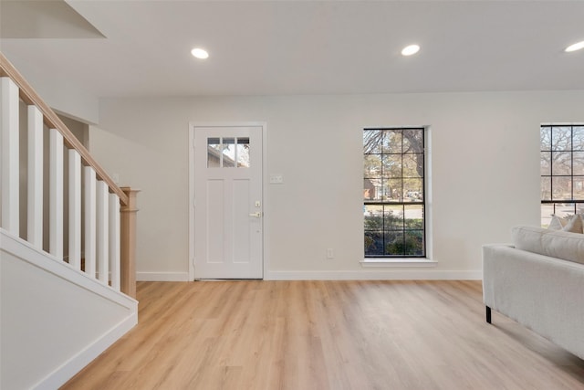 entryway with plenty of natural light and light hardwood / wood-style floors