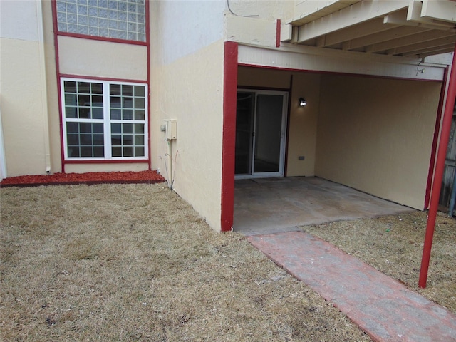 property entrance featuring a patio area