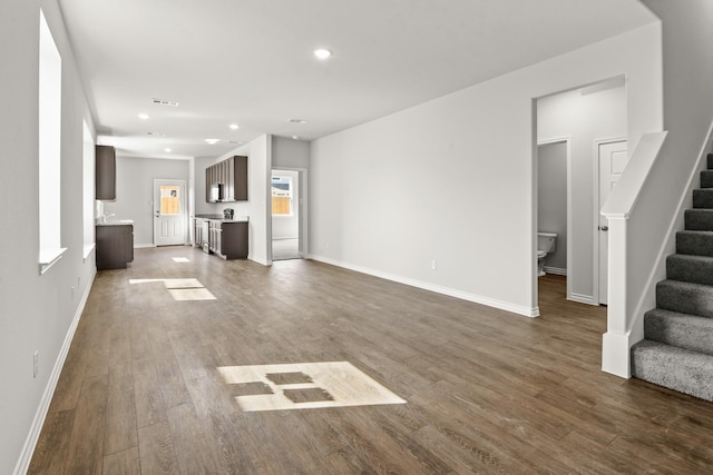 unfurnished living room with hardwood / wood-style flooring