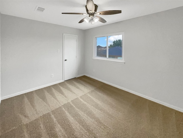 carpeted empty room with ceiling fan