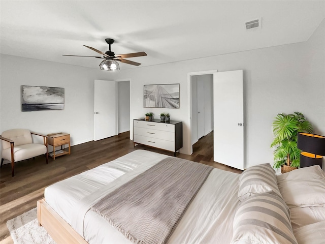 bedroom featuring ceiling fan and dark hardwood / wood-style floors