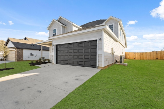 view of front facade with driveway, fence, central AC, and a front yard