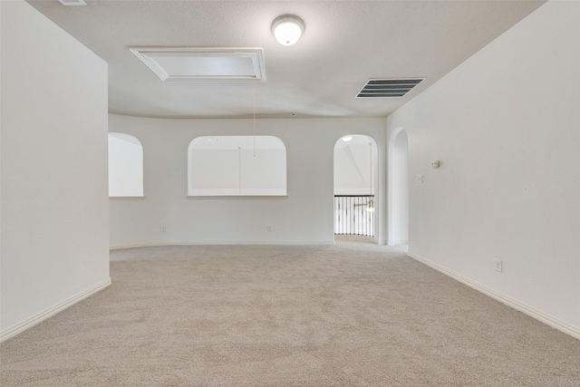 empty room featuring light colored carpet