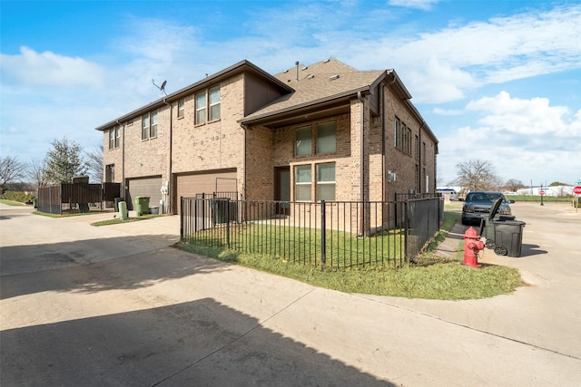 view of home's exterior with a garage and a lawn