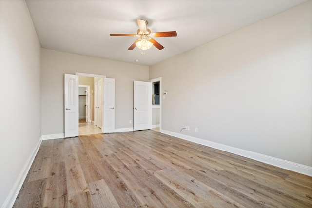 unfurnished bedroom with light wood-type flooring and ceiling fan