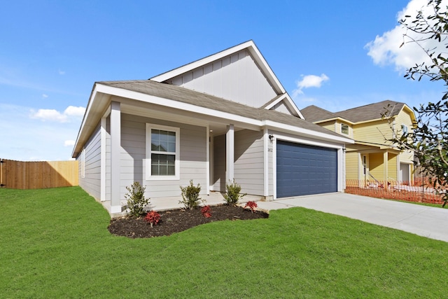 view of front of property with a garage and a front yard