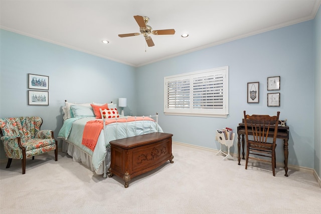 bedroom featuring crown molding, ceiling fan, and light carpet