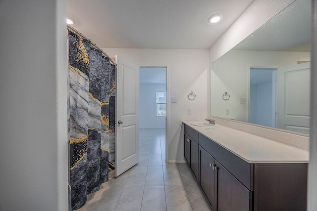 bathroom with vanity and tile patterned flooring