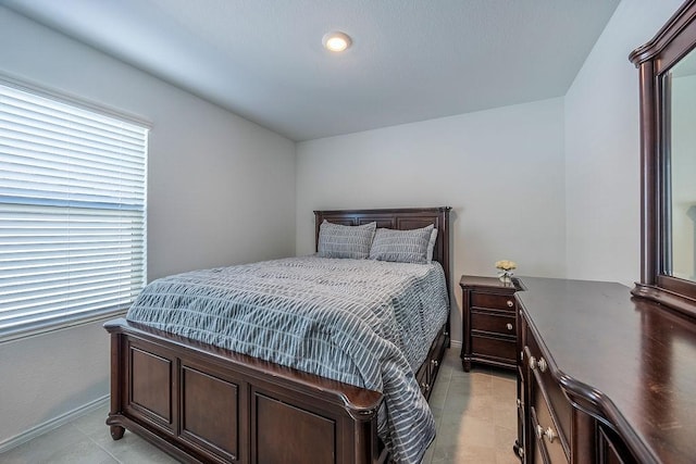 bedroom with light tile patterned floors