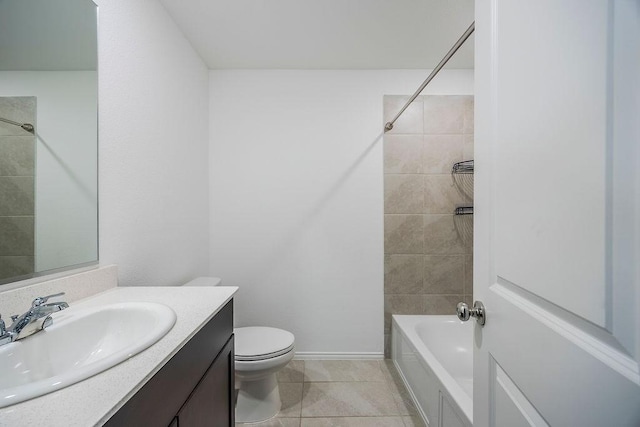 full bathroom with tiled shower / bath combo, vanity, tile patterned floors, and toilet