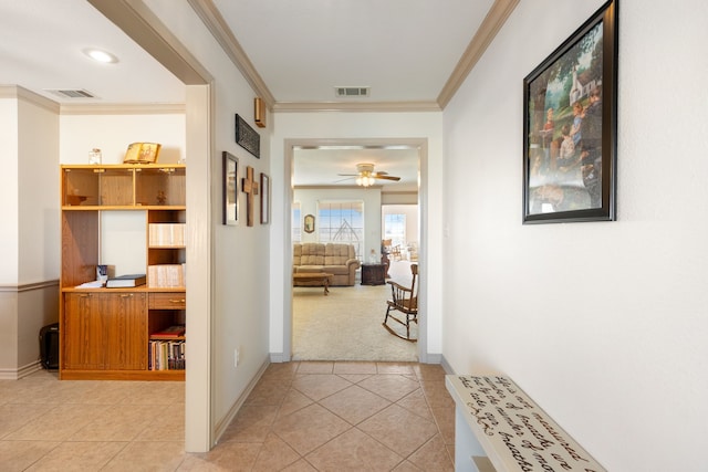 hall with light carpet and crown molding