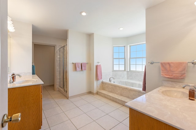 bathroom featuring tile patterned flooring, vanity, and separate shower and tub