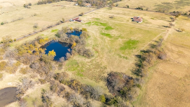 bird's eye view featuring a water view and a rural view