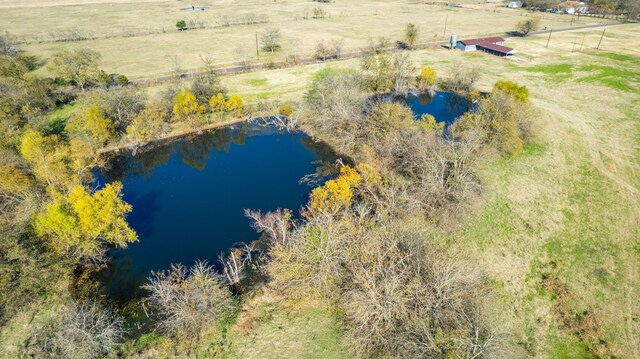 drone / aerial view with a rural view and a water view