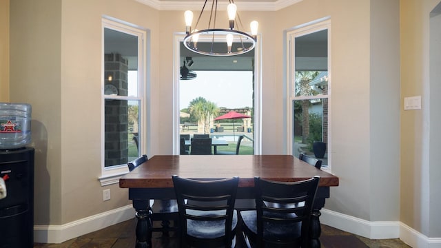 9557 Smith Rd, Royse City, TX 75189 - dining space featuring stone tile flooring, crown molding, a chandelier, and baseboards