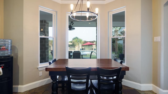 dining room featuring ornamental molding and a chandelier