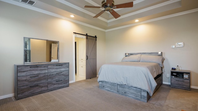 bedroom featuring crown molding, ceiling fan, a barn door, and a raised ceiling