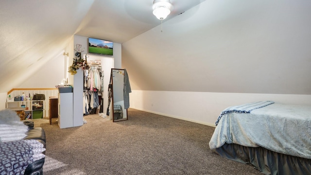 bedroom featuring vaulted ceiling, carpet flooring, and ceiling fan