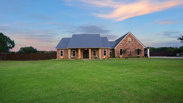 view of front of property with a yard