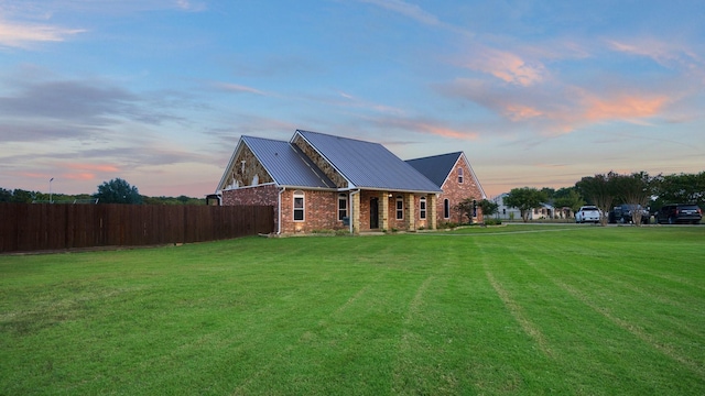 view of front of property with a yard