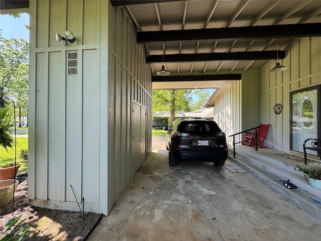 garage featuring an attached carport