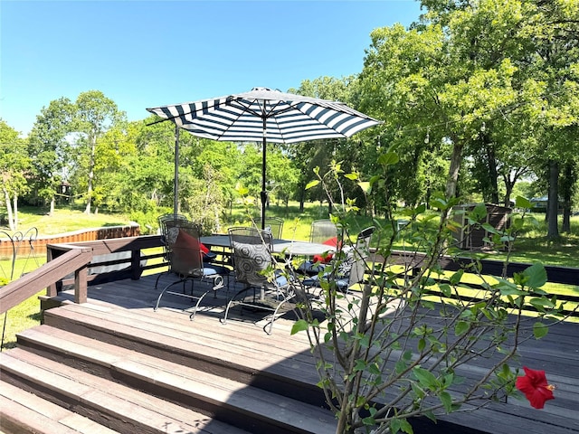 wooden deck featuring outdoor dining space