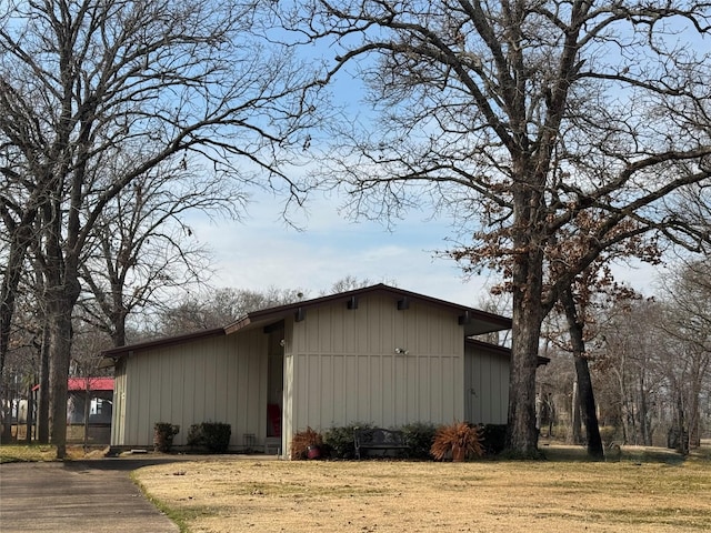 view of property exterior featuring a lawn