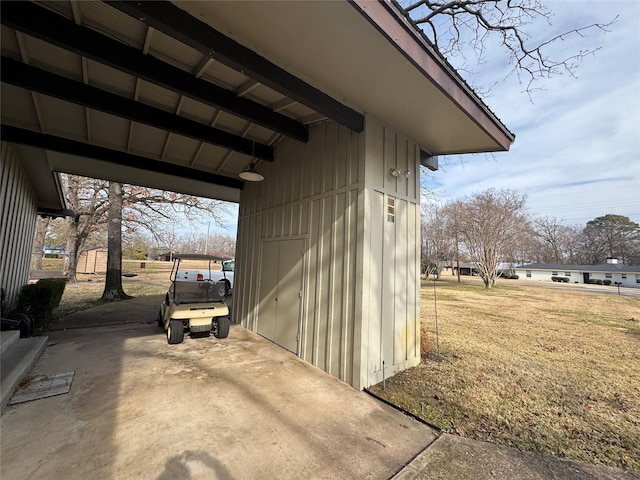 view of side of property with a yard