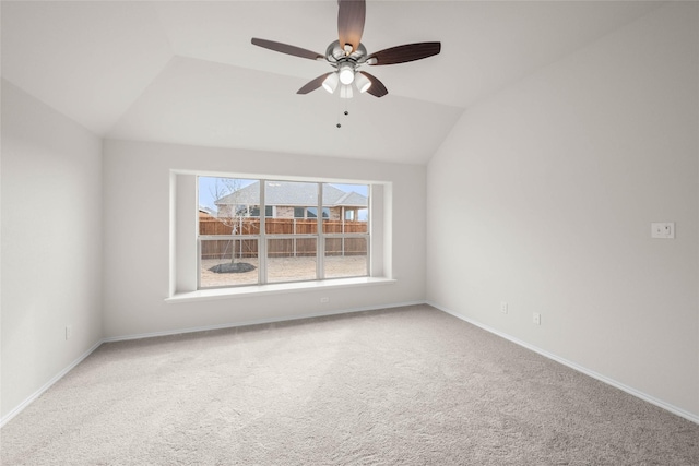 spare room with lofted ceiling, carpet flooring, and ceiling fan