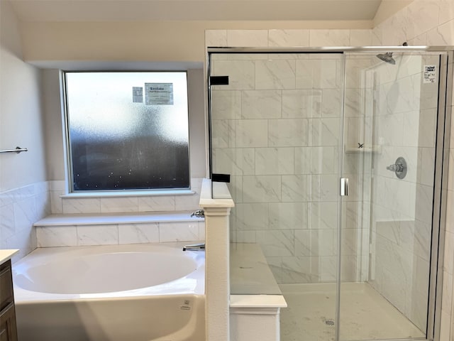 bathroom featuring vanity and plus walk in shower