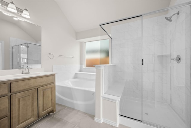 bathroom with vaulted ceiling, vanity, independent shower and bath, and tile patterned flooring