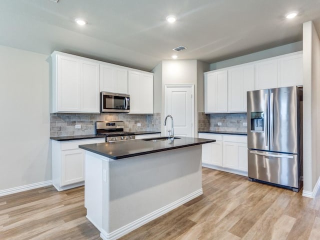 kitchen featuring white cabinetry, appliances with stainless steel finishes, and sink