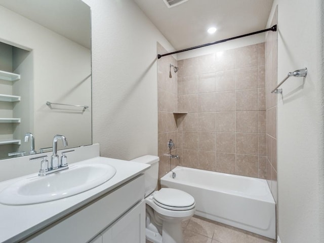 full bathroom with vanity, tiled shower / bath combo, tile patterned floors, and toilet