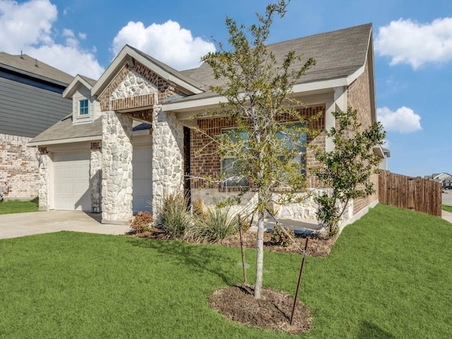 view of front of house featuring a garage and a front yard