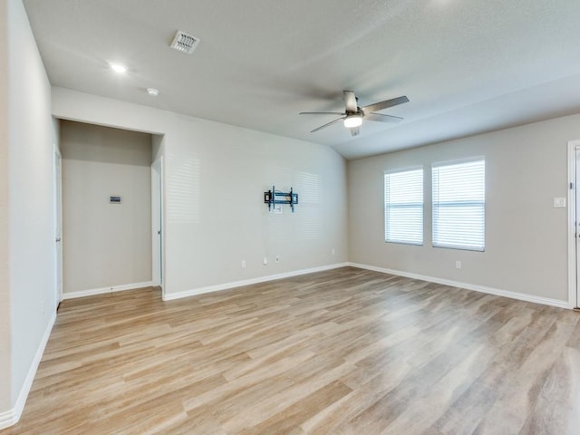 unfurnished room with ceiling fan and light hardwood / wood-style floors