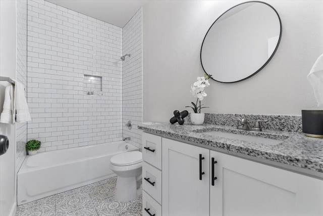 full bathroom with vanity, tile patterned floors, toilet, and tiled shower / bath