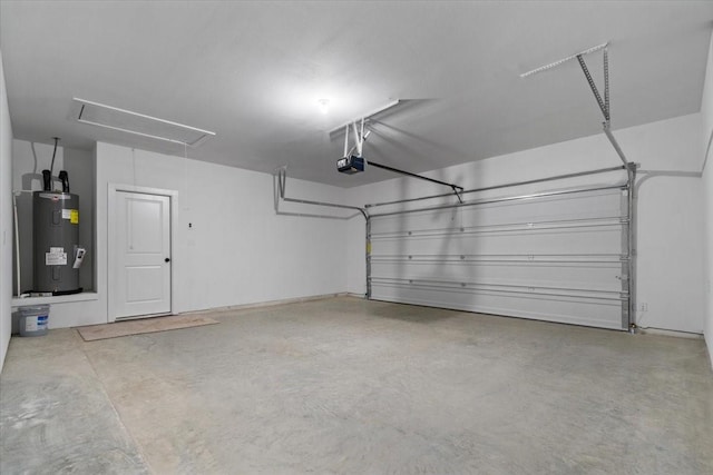 garage featuring a garage door opener and electric water heater