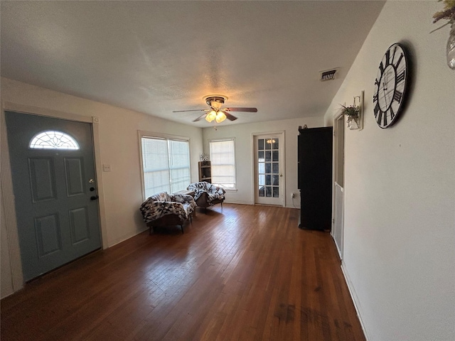 entryway featuring ceiling fan, a textured ceiling, and dark hardwood / wood-style flooring